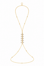 Magnolia Muse gold hand chain styled on the wrist