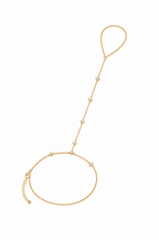 Blossom Muse gold hand chain styled on the wrist